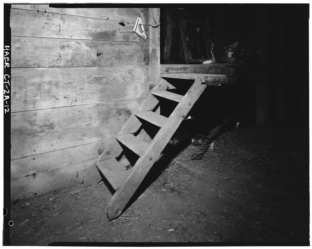 Short wooden stair in the barn interior