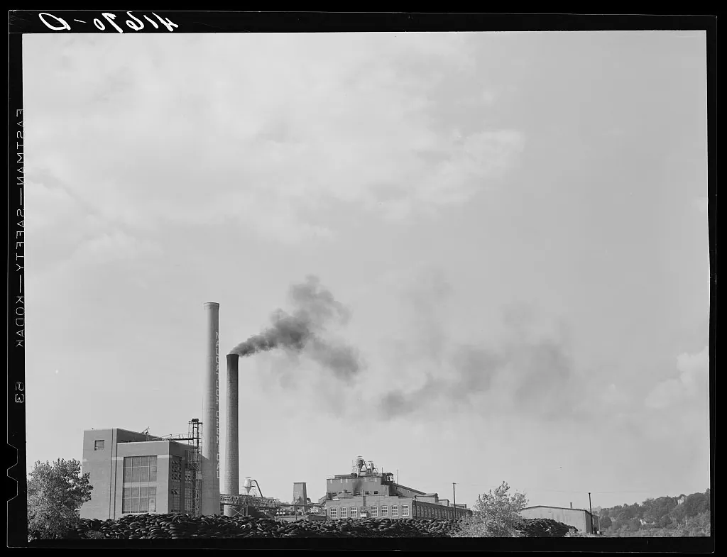 Naugatuck Chemical Company with piles of old rubber tires. Naugatuck, Connecticut · 1940-09