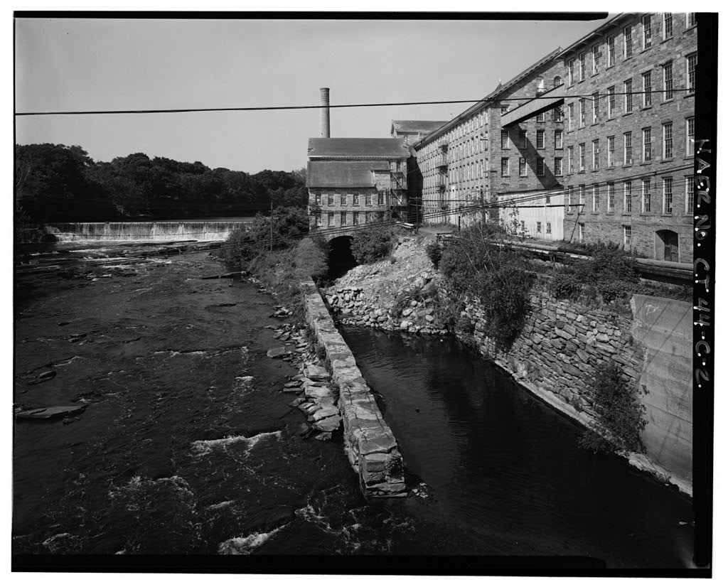 View southwest of tailrace; dam and wheelhouse wing at center