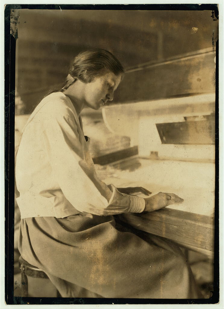 Examining fabric at a lighted table
