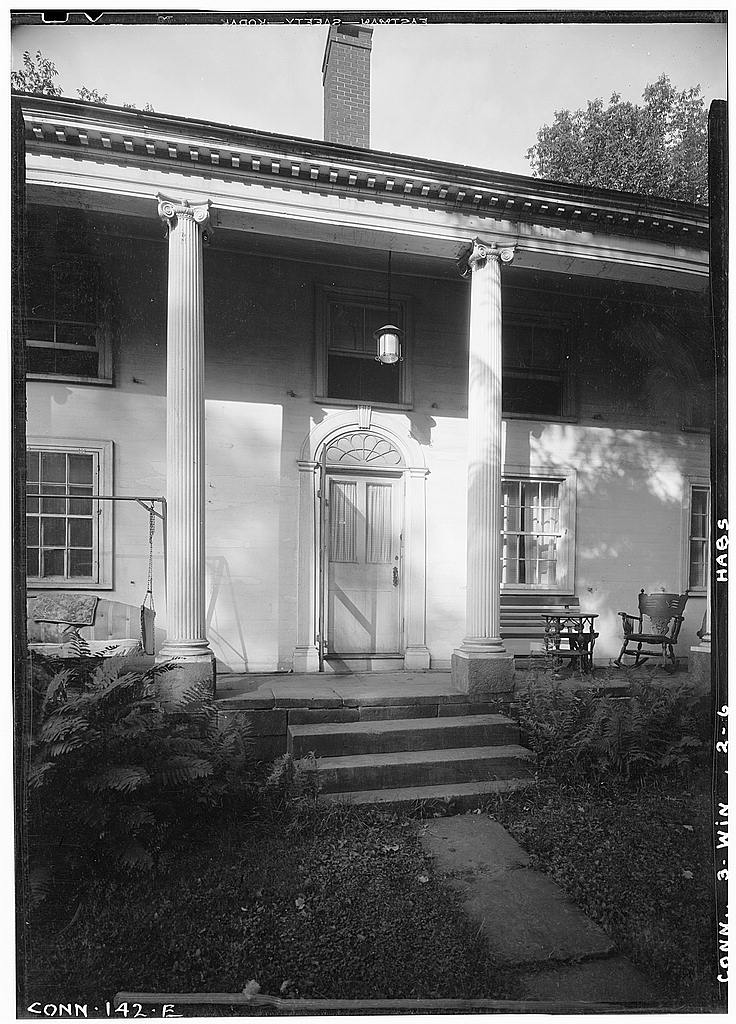 Exterior, detail of side doorway and ell colonnade