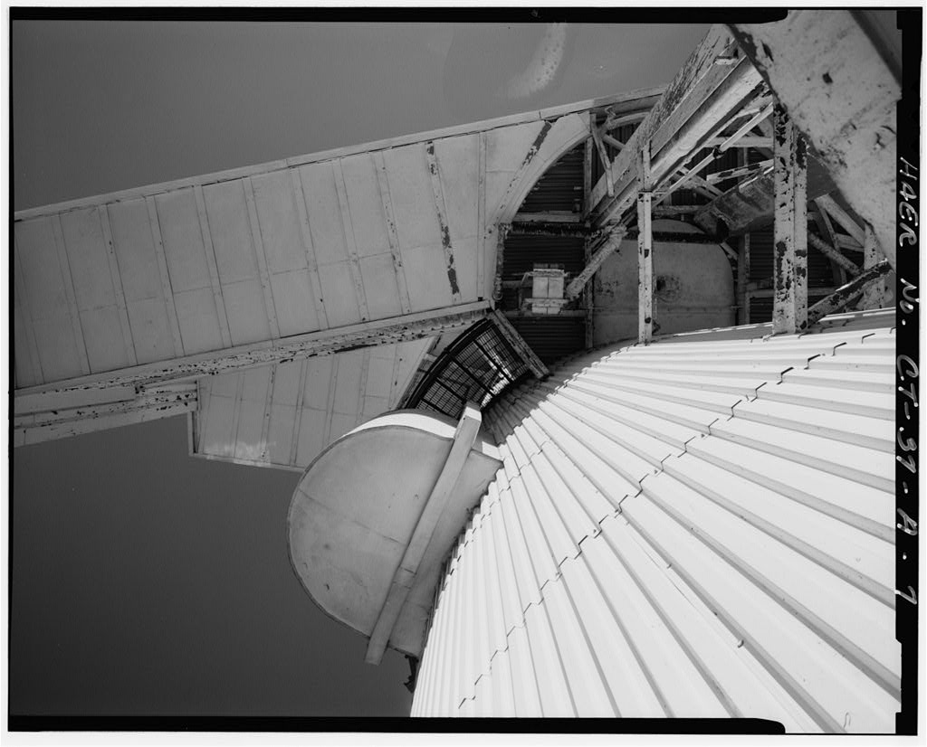 View of escape training tank, looking up south side from 50-foot passageway, showing 25-foot blister at left,…