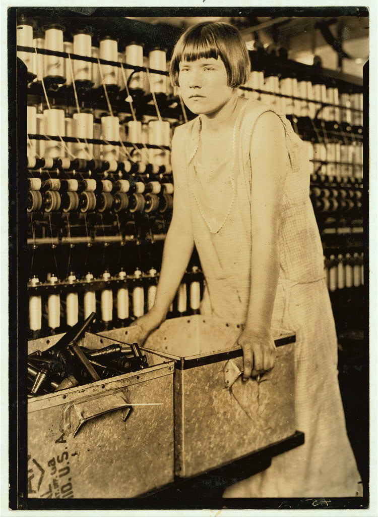 Young worker beside a wagon at the Cheney mills — 1924.