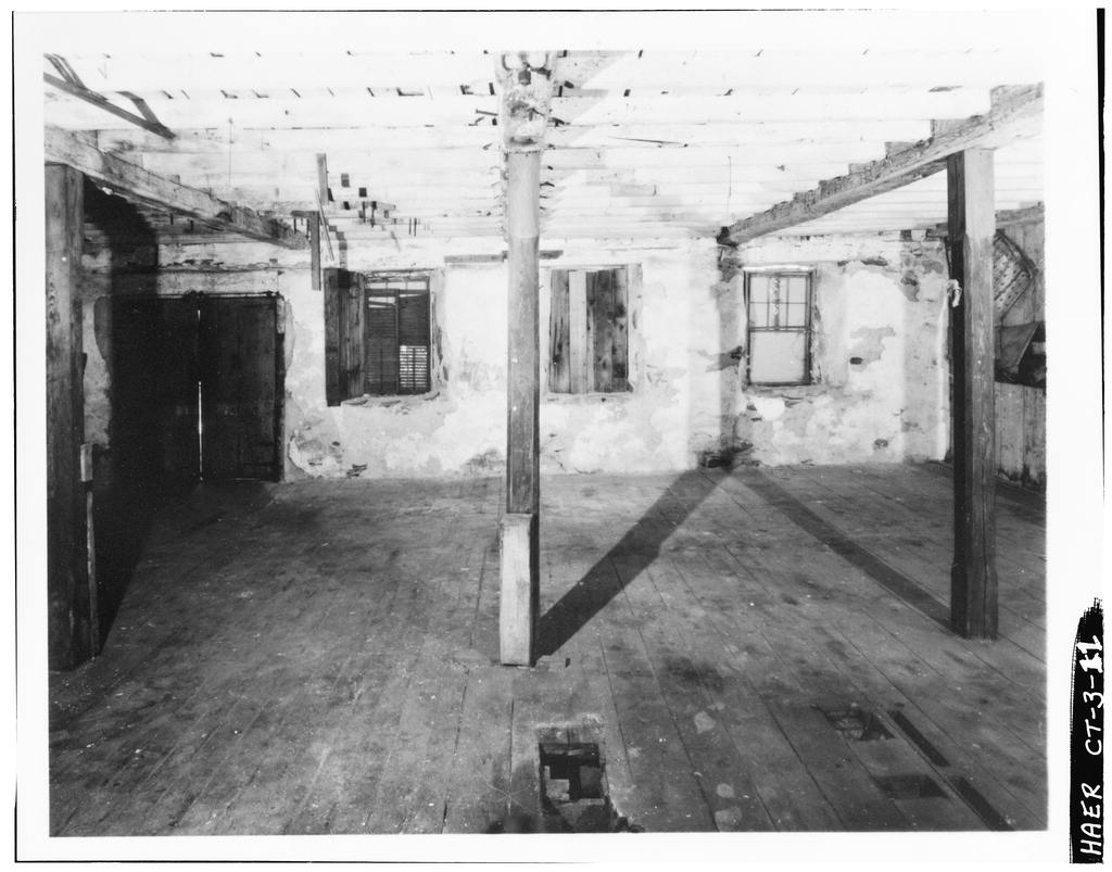 First floor: north wall, near northeast corner, looking north