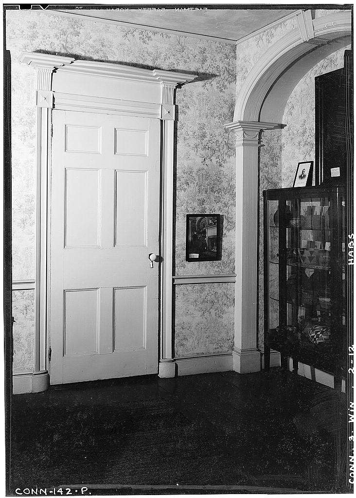 Interior, detail of door and archway, front living room, first floor