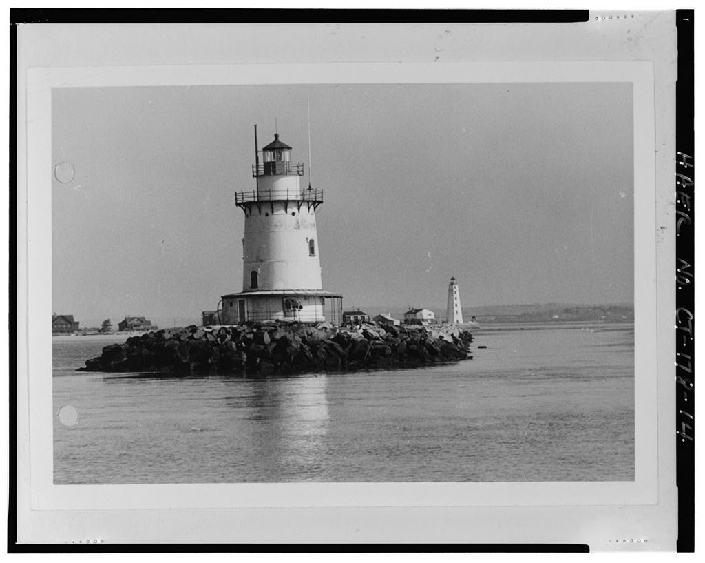 Photo copy of historic photograph, 1972, VIEW LOOKING NORTH, SHOWING ORIGINAL AWNING AT BASE OF LIGHTHOUSE. U.S. Coast Guard Civil Engineering Unit, Warwick, RI - Saybrook Breakwater Light, South tip of west end of Saybrook Breakwater, Old Saybrook, Middlesex County, CT